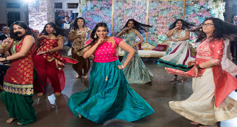 Indian Dance Choreographer_Gulabi Dance Co_bride and groom with the entourage