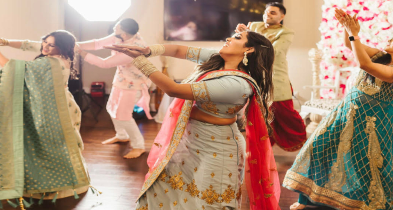 Indian Dance Choreographer_Gulabi Dance Co_bride and groom with the entourage
