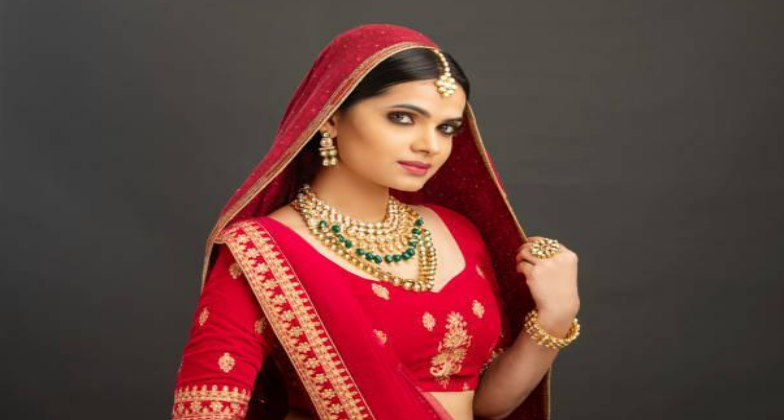 Photo of Bridal Makeup with Red Lehenga and Hairstyle with Roses