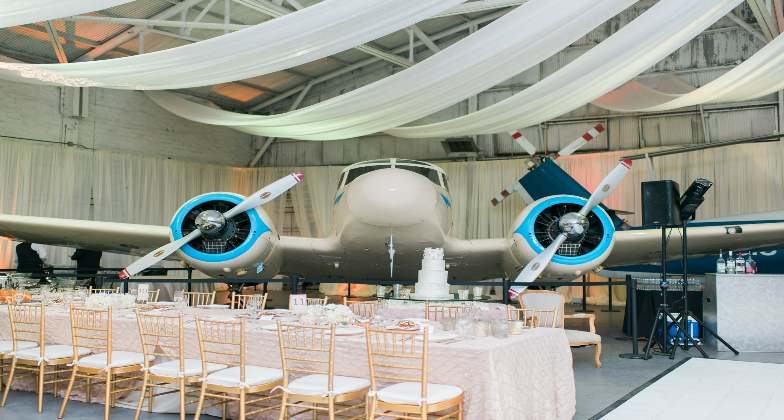 Indian Wedding Venue_1940 Air Terminal Museum_Reception with lifesize airplane