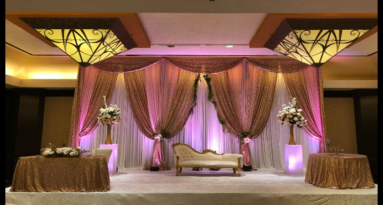 Indian Wedding Venue_Hilton Richardson Dallas_pink white and gold stage for the couple